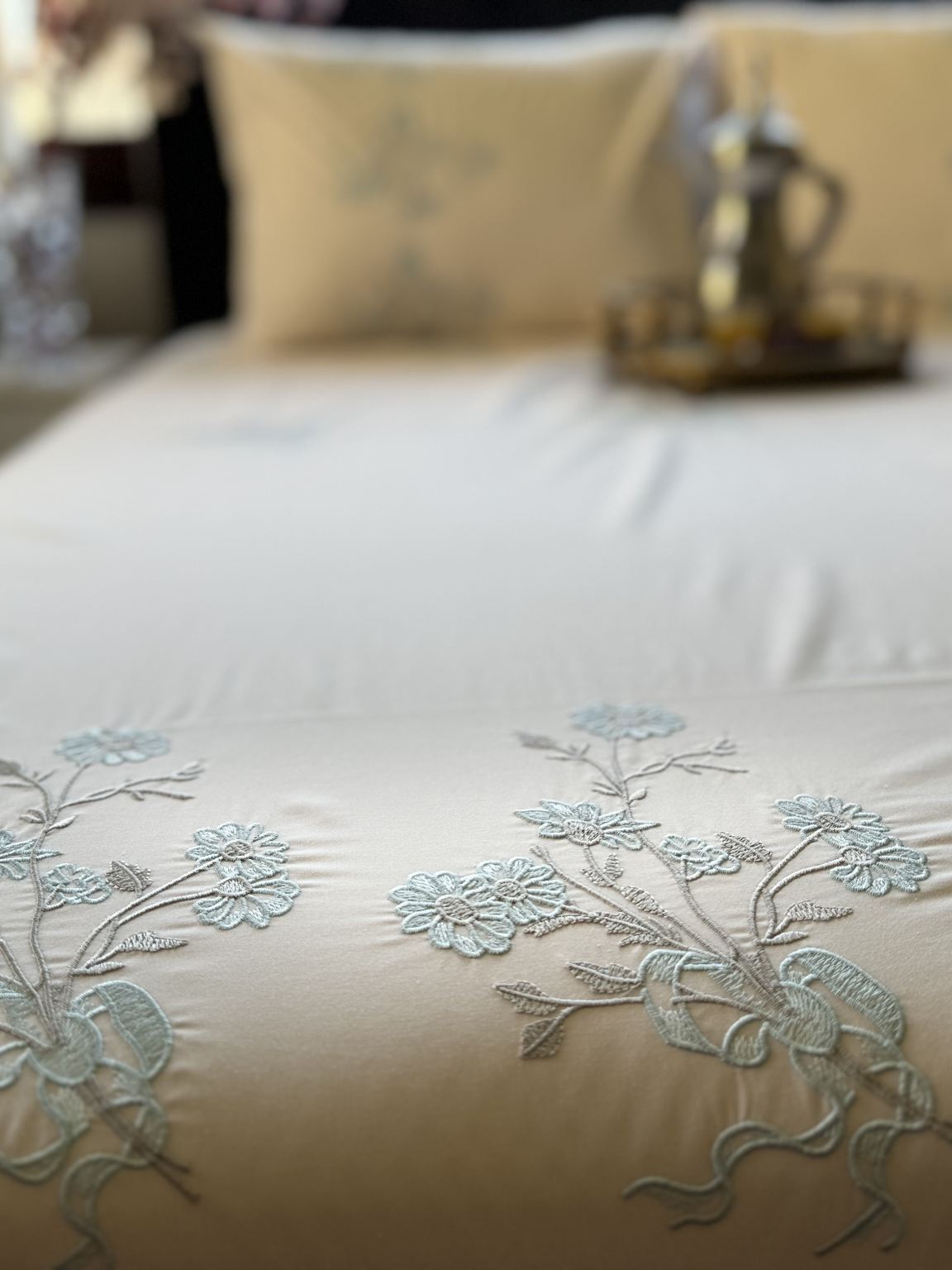 FEKRAT embroidered Egyptian cotton bedding set on a made bed | Hareer x Hareer